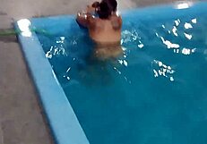 Hot Day Redhead Basks Nude in Pool