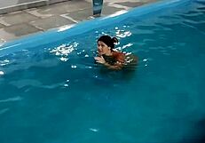 Hot Day Redhead Basks Nude in Pool