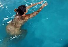 Hot Day Redhead Basks Nude in Pool