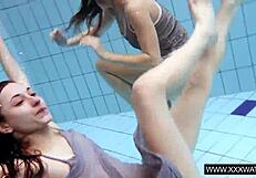 Shaved big tit brunette teases tight pussy underwater in shower