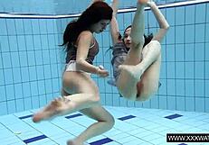 Shaved big tit brunette teases tight pussy underwater in shower