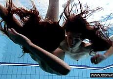 Shaved big tit brunette teases tight pussy underwater in shower