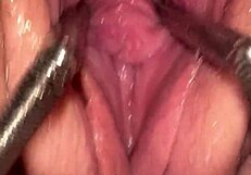 Fist queen's pussy stretches wide with metal ring.