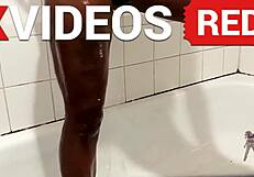 Sexy black milf showers naked showing long beautiful legs.