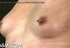 This brunette babe in bdsm gear rides her huge sex toy hardcore while masturbating wildly