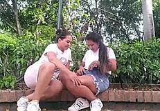 naughty colombian lesbians kiss and finger juicy pussies in bold public park dare