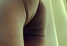 Guy strokes big cock publicly by bedroom window