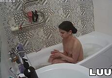 Luuv Vilika bares small tits in private late-night bathroom flash voyeur