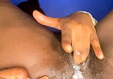 Creamy ebony babe fingers wet pussy in solo tease