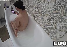 Luuv Vilika bares small tits in private late-night bathroom flash voyeur