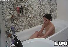 Luuv Vilika bares small tits in private late-night bathroom flash voyeur