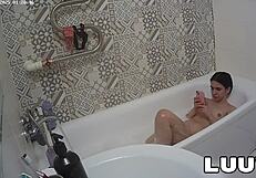 Luuv Vilika bares small tits in private late-night bathroom flash voyeur