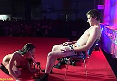 can you believe these flexible babes in fishnets ripping clothes for extreme public strapon pounding on stage?