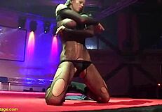 can you believe these flexible babes in fishnets ripping clothes for extreme public strapon pounding on stage?