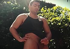 outdoor bodybuilder strokes monster cock under the sun nature's sexy display