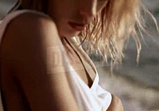 BLONDE RUSSIAN in see-through bra on beach nipples hard wet skin glistening with salt SEXY tease