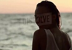 BLONDE RUSSIAN in see-through bra on beach nipples hard wet skin glistening with salt SEXY tease