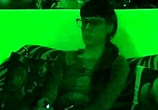 Beth's Kinky Goth Domina Smokes Seductively in Green