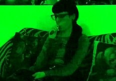 Beth's Kinky Goth Domina Smokes Seductively in Green