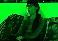 Beth's Kinky Goth Domina Smokes Seductively in Green