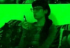 Beth's Kinky Goth Domina Smokes Seductively in Green