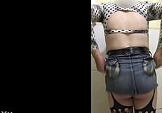 shemale in short skirt teases in the bathroom ready for action