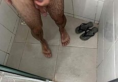 Ever seen a hung stud stroke his thick massive cock in the shower?