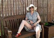 Naughty housewife strips naked outdoor garden tease?