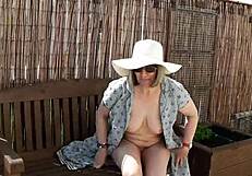 Naughty housewife strips naked outdoor garden tease?