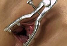 Seductive tattooed babe in heels rips clothes to spread pussy wide with speculum closeup