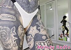 melody radford tries on skimpy pink micro bikini with chains for her big tits