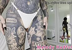 melody radford tries on skimpy pink micro bikini with chains for her big tits