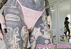 melody radford tries on skimpy pink micro bikini with chains for her big tits