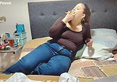 nicole loves devouring that big pizza on bed her chubby latina belly bulging in jeans