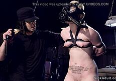 blonde slave bound in gas mask endures choking whips and rough gagging torment