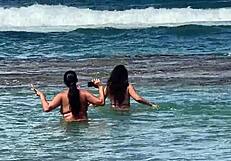 two pretty brazilian brunettes kiss and play on coral beach first time public