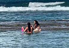 two pretty brazilian brunettes kiss and play on coral beach first time public