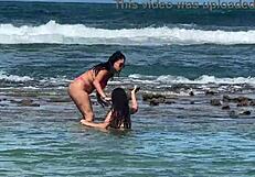 two pretty brazilian brunettes kiss and play on coral beach first time public