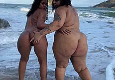 Friends reunite on beach and fuck passionately in public view