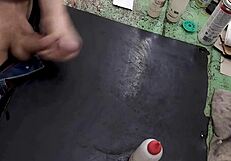 Skinny solo amateur jerks monster cock on workbench at work site