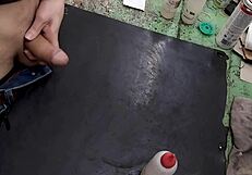 Skinny solo amateur jerks monster cock on workbench at work site