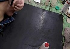 Skinny solo amateur jerks monster cock on workbench at work site