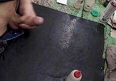 Skinny solo amateur jerks monster cock on workbench at work site