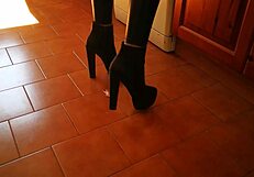 mistress in tall heels and boots dominates huge slave in garage bdsm session with ass worship