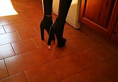 mistress in tall heels and boots dominates huge slave in garage bdsm session with ass worship