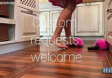 kicking off furry slippers to tease bare feet in kitchen