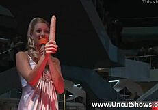 two blond babes strip and fuck on public stage