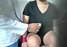 indian doctor examines lady patient's big boobs closely