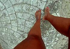 Boldly soiling barefoot feet on beach street