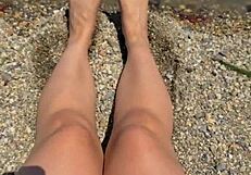 check out this curvy Asian brunette's huge natural tits and soft soles teasing on the beach